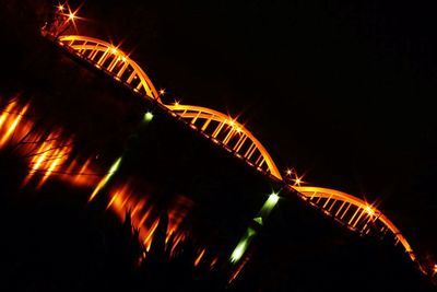 Low angle view of light trails at night