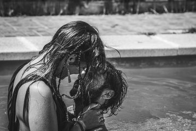 Romantic couple romancing in swimming pool