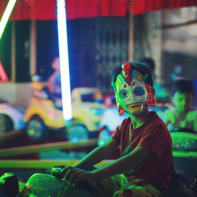 VIEW OF PEOPLE AT AMUSEMENT PARK