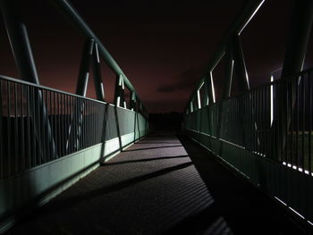 Illuminated bridge at night