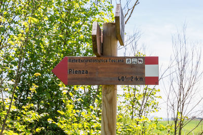 Information sign against trees