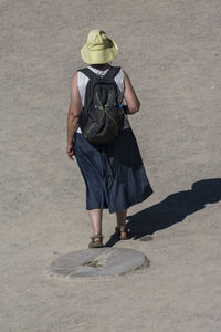 Full length of woman standing by railing