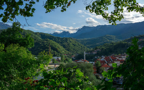 High angle view of trees and mountains against sky