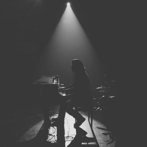 MAN PLAYING PIANO AT NIGHTCLUB