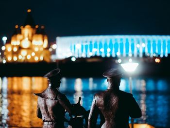 Rear view of people at illuminated music concert