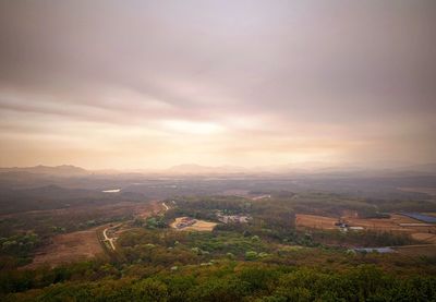 Scenic view of landscape against sky during sunset