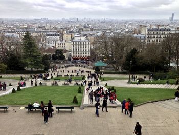 People at town square against sky