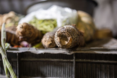 Fresh yam vegetable at vegetable store fro sale with shallow depth of field and blurred background