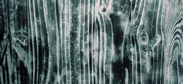 Full frame shot of wet glass window