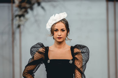 Portrait of young woman looking at camera