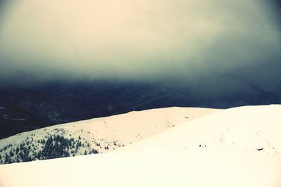 Scenic view of mountains against sky during winter