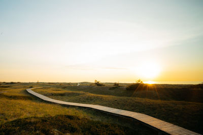 Scenic view of landscape against sky during sunset