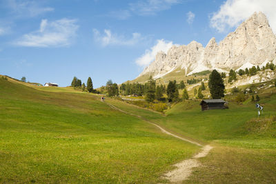 Scenic view of golf course against sky