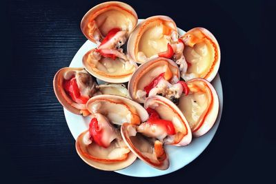 High angle view of eggs in bowl against black background