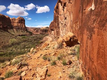 View of rock formations against cloudy sky