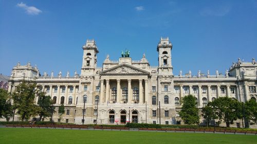 Low angle view of historical building against blue sky