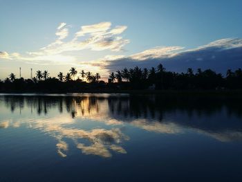 Scenic view of lake against sky during sunset