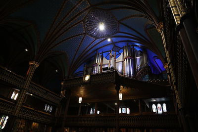 Low angle view of illuminated ceiling