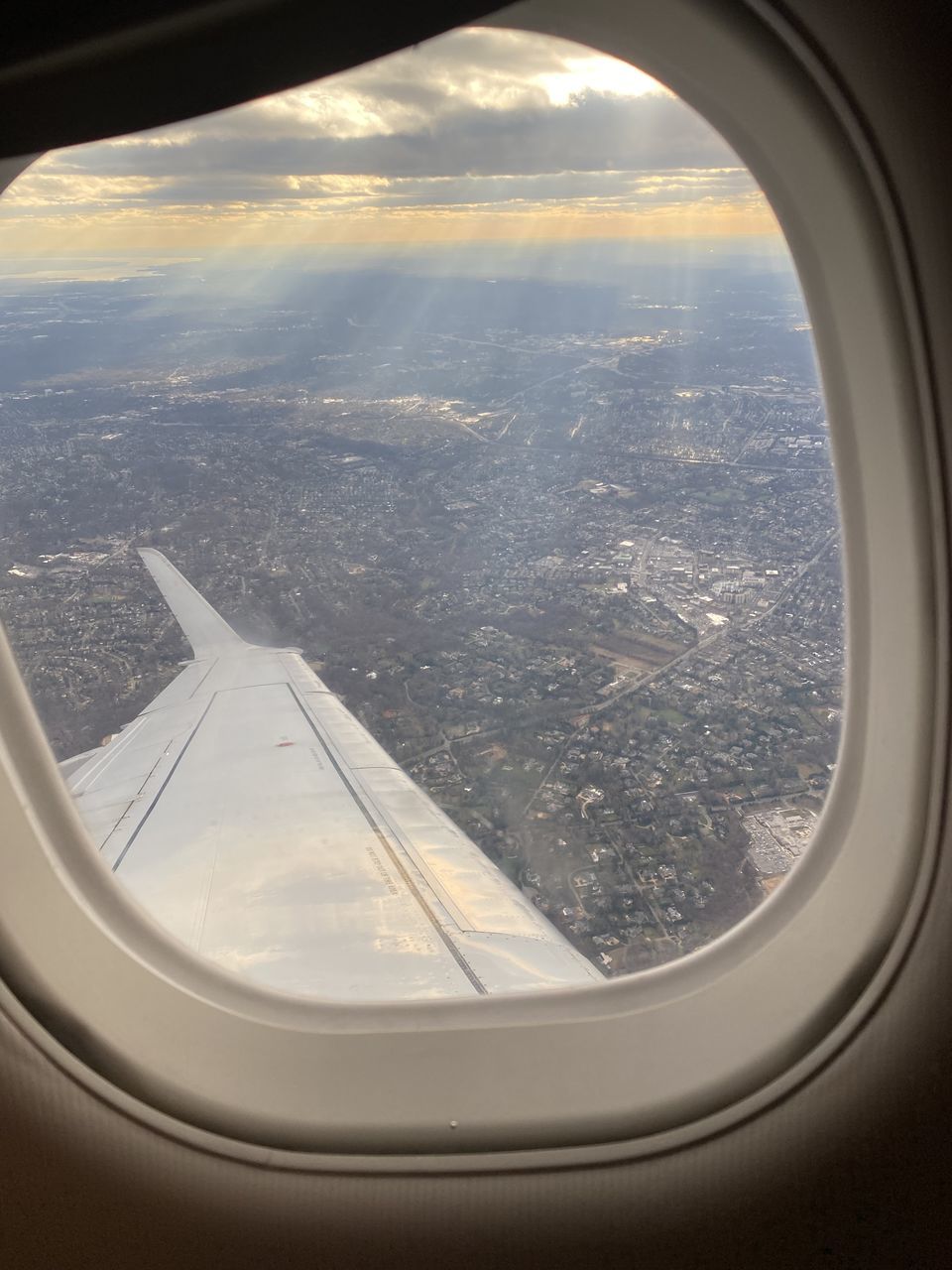 window, airplane, transportation, light, air vehicle, mode of transportation, glass, vehicle interior, travel, flying, porthole, nature, sky, no people, blue, white, indoors, mid-air, journey, day, transparent, automotive exterior, close-up, cloud, aircraft wing, looking, lighting, environment