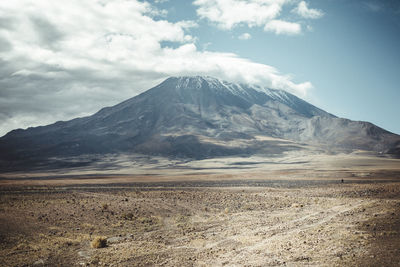 Volcano in atacama desert with clouds