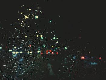 Close-up of illuminated water at night