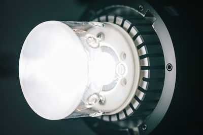 Close-up of electric lamp against black background