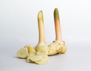 Close-up of bananas against white background