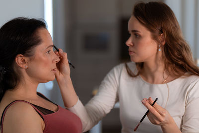 Young woman looking at clinic