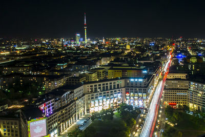 High angle view of illuminated buildings in city at night