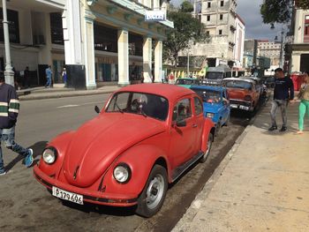 Car on street against buildings in city