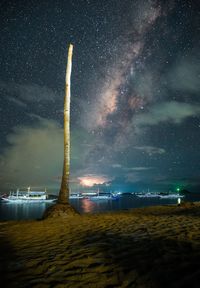 Scenic view of sea against sky at night