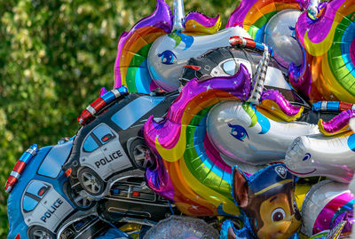 Close-up of toys for sale at amusement park