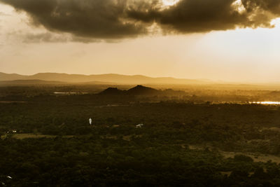 Scenic view of landscape against sky during sunset