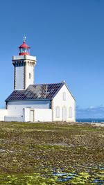 Lighthouse by sea against clear blue sky on belle Île island in bretany, france