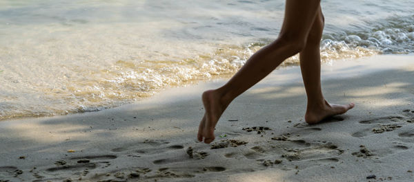 Low section of person on beach