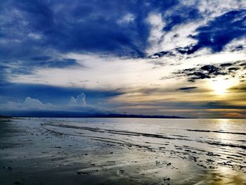 Scenic view of sea against sky at sunset