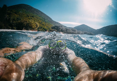 Close-up of man swimming in lake