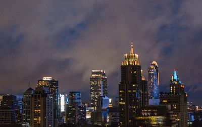 Illuminated buildings in city at night