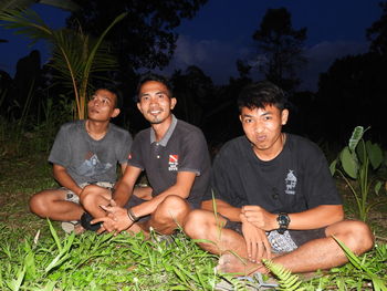 Young couple sitting on plants