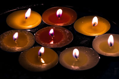 High angle view of illuminated candles in building