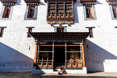 People in front of historic building