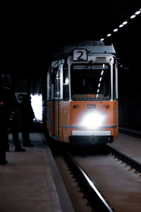 Train at railroad station at night