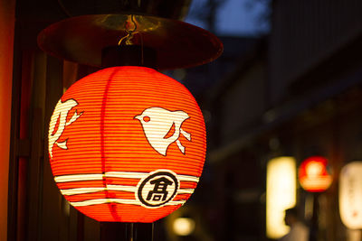 Close-up of illuminated lantern hanging at night