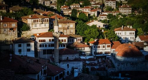 Houses in town against sky