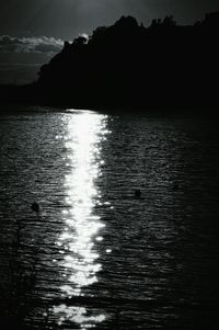 Scenic view of lake against sky at sunset