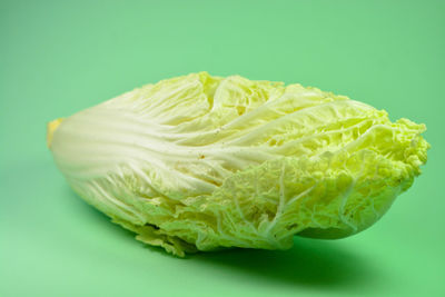 Close-up of lemon slice over white background