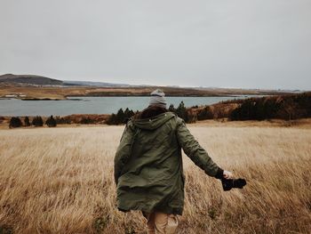 Woman standing on field