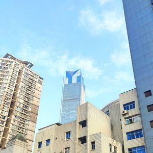 Low angle view of modern buildings against sky