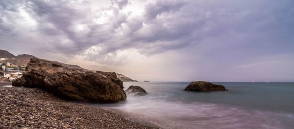 Scenic view of sea against cloudy sky