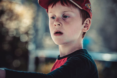 Portrait of boy looking away outdoors